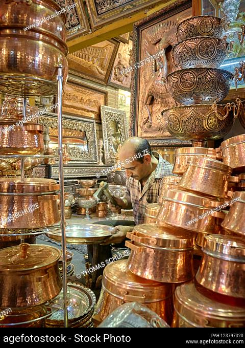 A coppersmith in the grand bazaar of the city of Isfahan in southern Iran, taken on April 26, 2017. The bazaar (Bazar-e Qeysariyeh or Bazar-e Bozorg) at Imam...