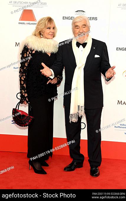 18 January 2020, Bavaria, Munich: Mario Adorf, actor and his wife Monique, come to the 47th German Film Ball at the Hotel Bayerischer Hof