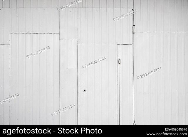 Old metal box with a door , white metal sheets with rivets, background or texture