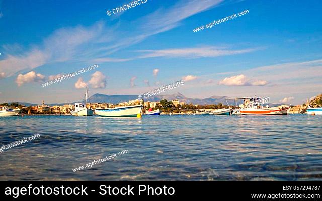 Wooden fishing boats in harbor on the Mediterranean island of Corfu, Greece