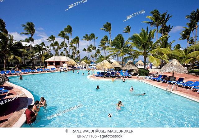 Tourists at the swimming pool at Grand Oasis Holiday Resort in Punta Cana, Dominican Republic, Caribbean