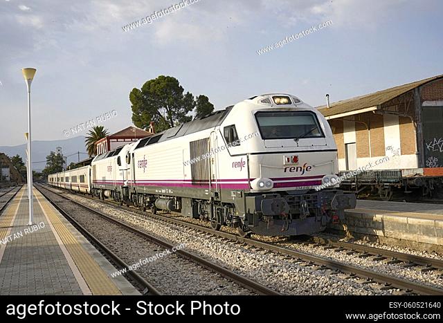 Train departing from Guadix railway station after a commercial stop (Guadix, Granada, Spain)