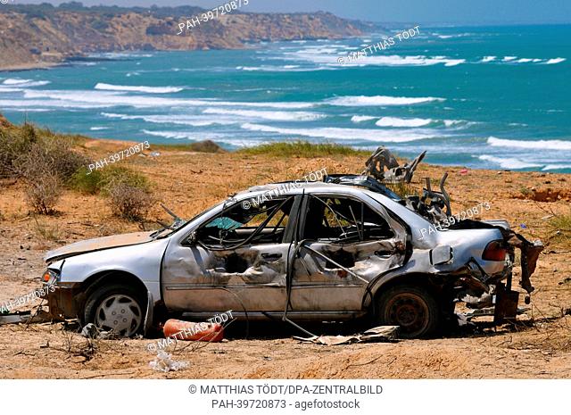 A demolished car, which was suspected to carry a car bomb, is pictured on an explosion ground near Tripolis, Libya, 6 May 2013