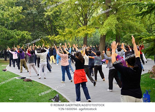 Older women exercising in Zizhuyuan Purple Bamboo Park in Beijing on National holiday