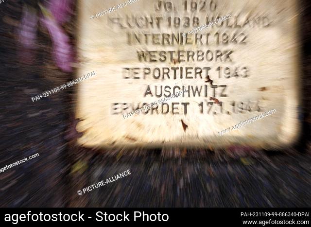 09 November 2023, North Rhine-Westphalia, Bielefeld: The words ""Deported"", ""Auschwitz"" and ""Murdered"" are written on a Stumbling Stone
