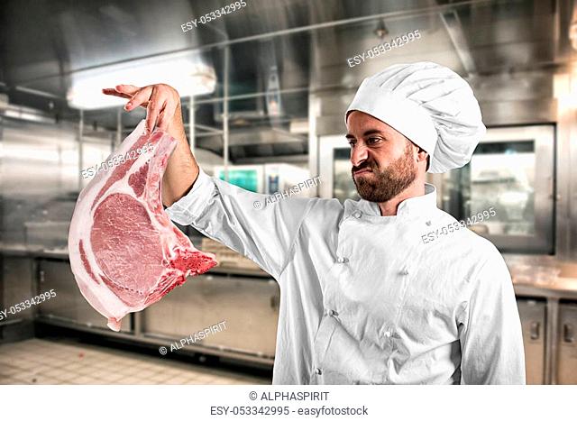 Vegetarian chef looks disgusted a big steak