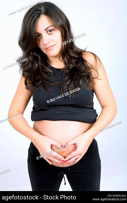 young beautiful pregnant woman, studio picture