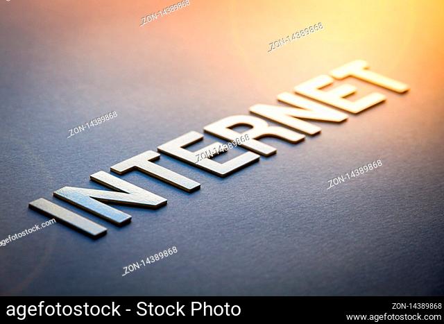 Word internet written with white solid letters on a board