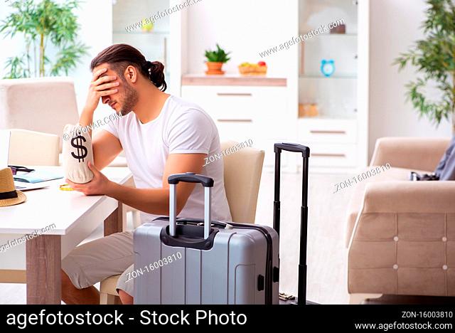 Young man preparing for the departure at home