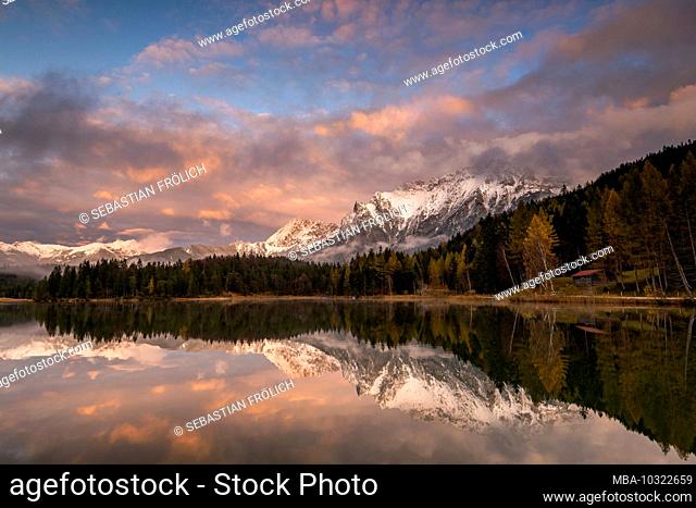 Autumn at Lautersee near Mittenwald, with the Karwendel, snow and sunset in the background