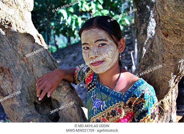 A young girl from the ethnic Murong community using traditional skincare cream on her face Tindu in Bandarban, Bangladesh December 2, 2009