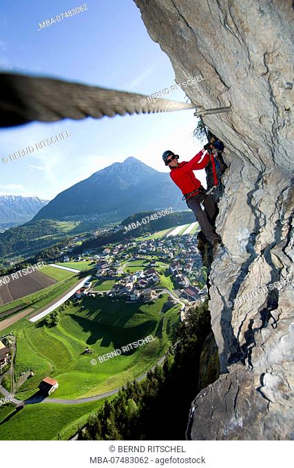 Climber on Steinwand via ferrata near Arzl, Pitztal, Tyrol, Austria