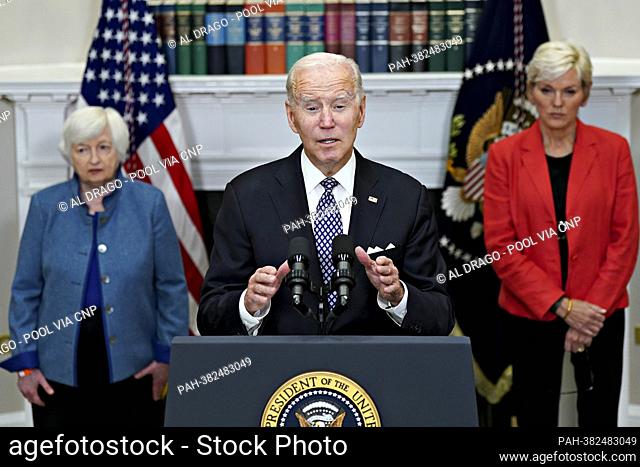 United States President Joe Biden speaks as US Secretary of the Treasury Janet Yellen, left, and US Secretary of Energy Jennifer Granhol right