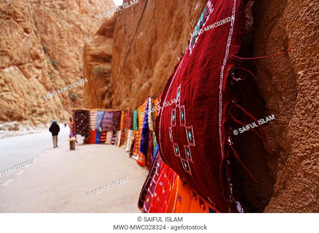 Handicrafts, including carpets and locally made textiles by the Berber tribespeople displayed in the Dades Gorge (also known as a Road of a thousand Kasbahs )...