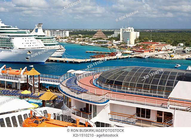 Carnival Ecstacy and two Royal Caribbean cruize ships at port in Cozumel, Mexico in the Caribbean Sea