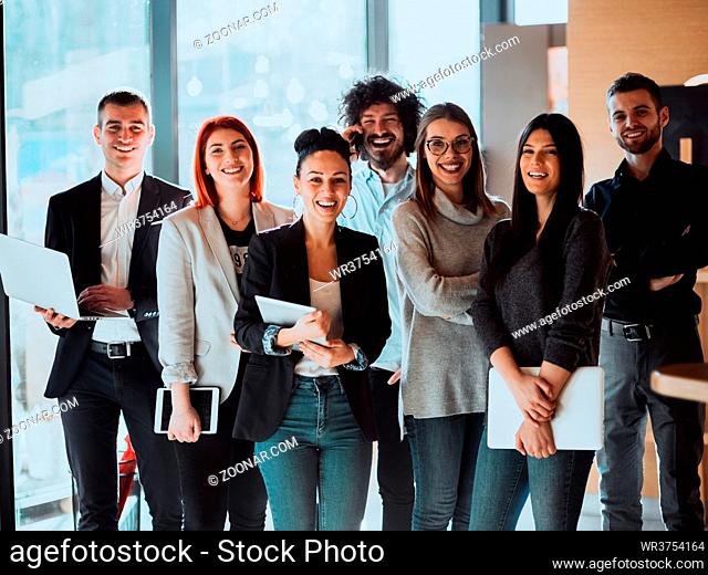 Portrait of Business team Standing in Modern Office on training in modern Office. Modern coworking startup open space office. High quality photo