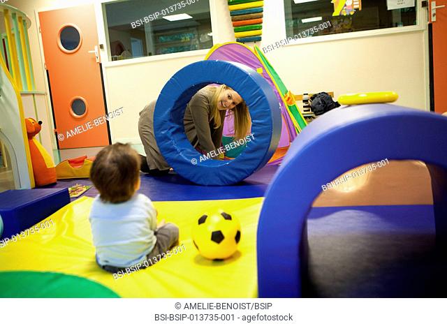 Reportage on a psychomotor specialist practising in a day nursery in Paris, France. This small 2-year old boy has a delayed growth rate and has psychomotor...