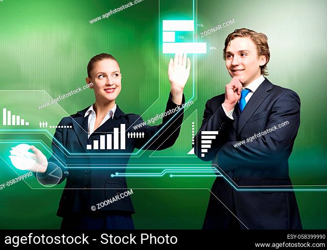 Young businessman and businesswoman working in cooperation with virtual panel