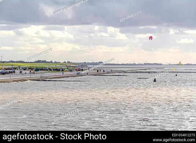 coastal scenery including some kitesurfers near Neuharlingersiel in Eastern Frisia, Germany