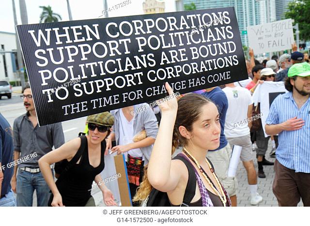 Florida, Miami, Biscayne Boulevard, Freedom Torch, Occupy Miami, demonstration, protest, protesters, anti Wall Street, banks, corporate greed, sign, poster