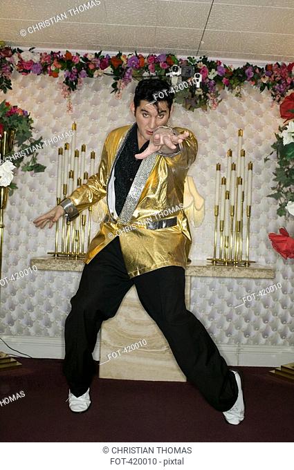 Elvis impersonator standing at the altar in a wedding chapel, Las Vegas, Nevada