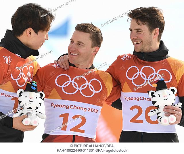 Switzerland's Nevin Galmarini (c, gold), South Korea's Lee Sang Ho (l, silver) and Slovenia's Zan Kosir (r, bronze) celebrate their performances at the men's...