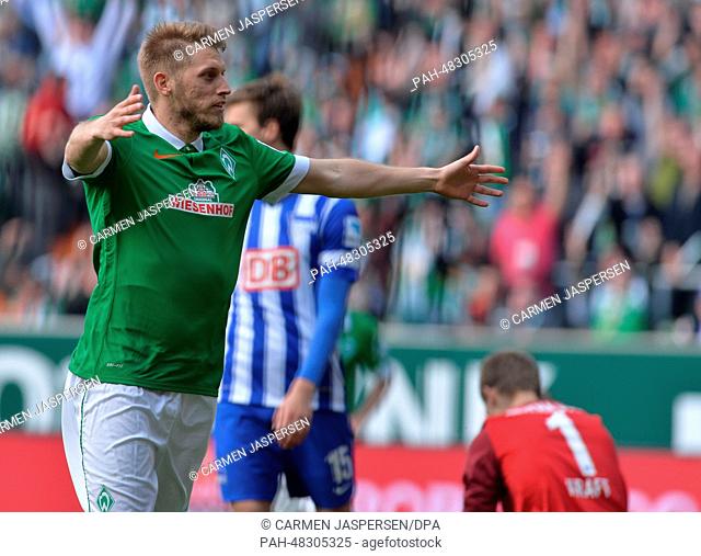 Bremen's Aaron Hunt celebrates his 1-0 goal during the Bundesliga soccer match between Werder Bremen and Hertha BSC at Weserstadium in Bremen, Germany