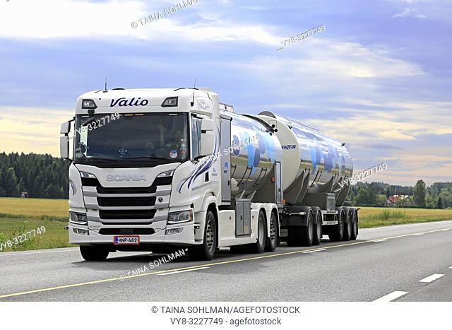 Koski Tl, Finland - August 4, 2018: White Next Generation Scania G500 milk tank truck transports Valio milk along highway 10 on a summer afternoon