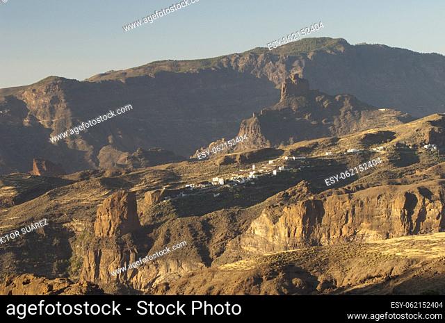 Roque Palmes (foreground), village of El Toscon and Roque Bentayga (background). The Nublo Rural Park. Gran Canaria. Canary Islands. Spain