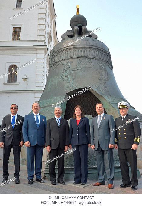 The Expedition 53-54 prime and backup crewmembers pose for pictures in front of the Tsar Bell at the Kremlin in Moscow Sept