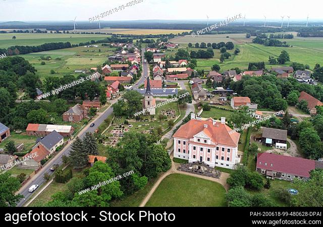12 June 2020, Brandenburg, Groß Rietz: The castle Groß Rietz with the village church and the cemetery (aerial view with a drone)