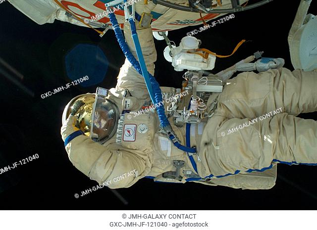Russian cosmonauts Maxim Suraev and Oleg Kotov (out of frame), both Expedition 22 flight engineers, participate in a session of extravehicular activity (EVA) as...