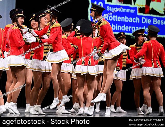 19 March 2023, Baden-Württemberg, Stuttgart: The ladies of the Carnival Club Röttenbach Die Besenbinder Garde are happy about their victory at the German...