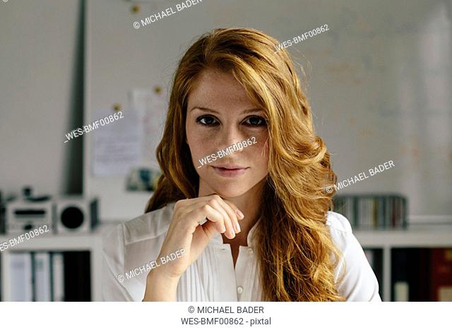 Portrait of confident young woman in office
