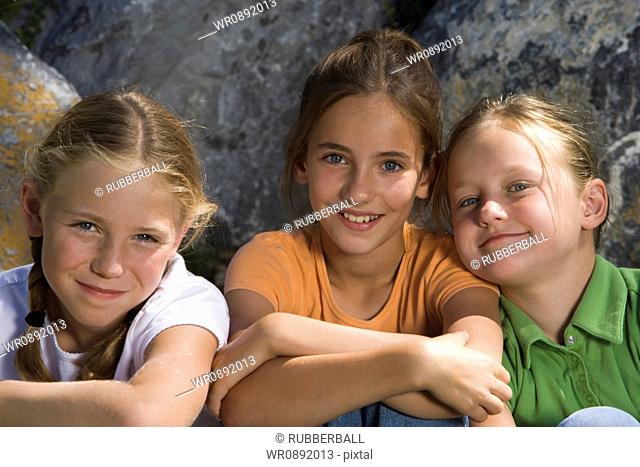 Portrait of three girls sitting together