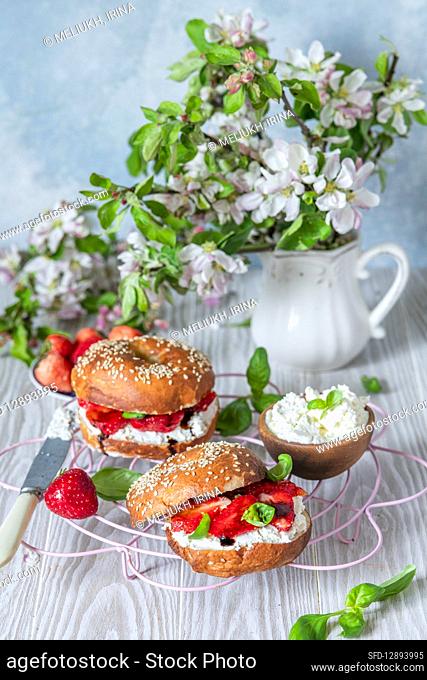 Bagels with cream cheese and strawberries