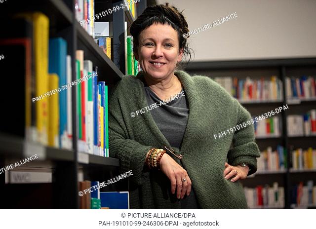 10 October 2019, North Rhine-Westphalia, Bielefeld: Polish author Olga Tokarczuk is standing at a bookshelf in the run-up to a reading