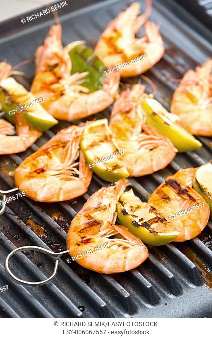 prawn skewers with lime on electric grill