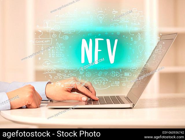 hand working on new modern computer with NFV abbreviation, modern technology concept