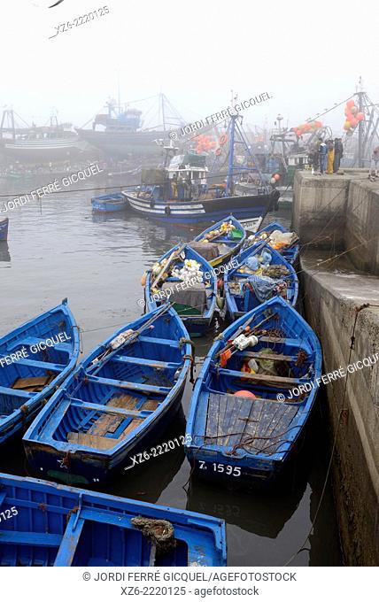 Essaouira fishing harbour in the morning with fog, Morocco, Africa