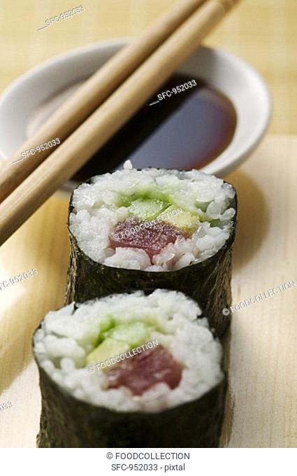 Maki sushi with tuna, cucumber and avocado close-up