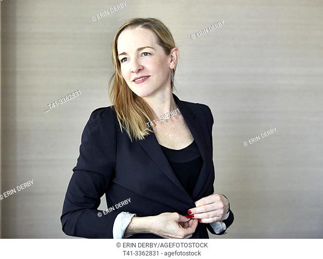 Woman in office wearing blazer