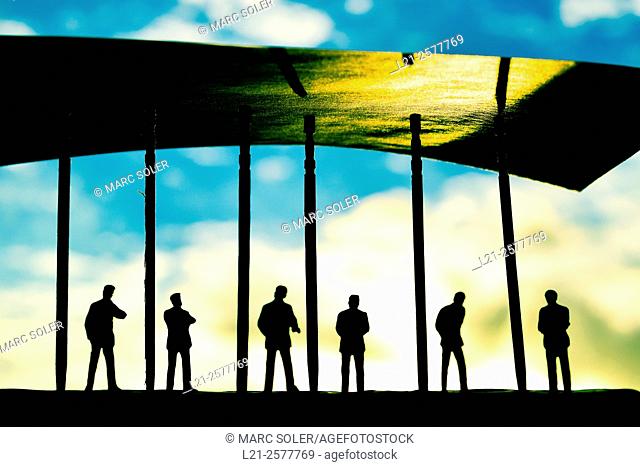 Silhouettes of men watching the blurred sky and clouds