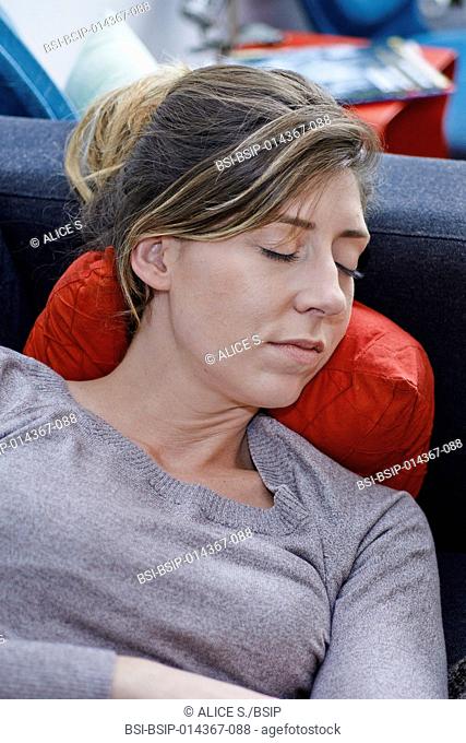 woman napping on sofa