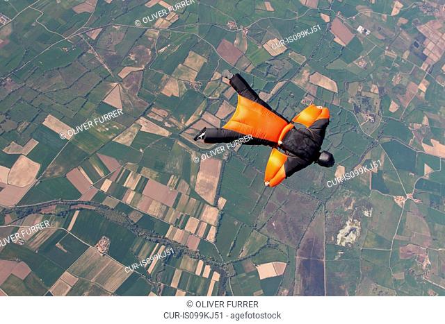 Man wingsuit flying over Empuriabrava, Spain