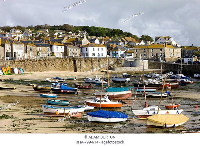 Views over Mousehole village and harbour at low tide, Mousehole, Cornwall, England, United Kingdom, Europe