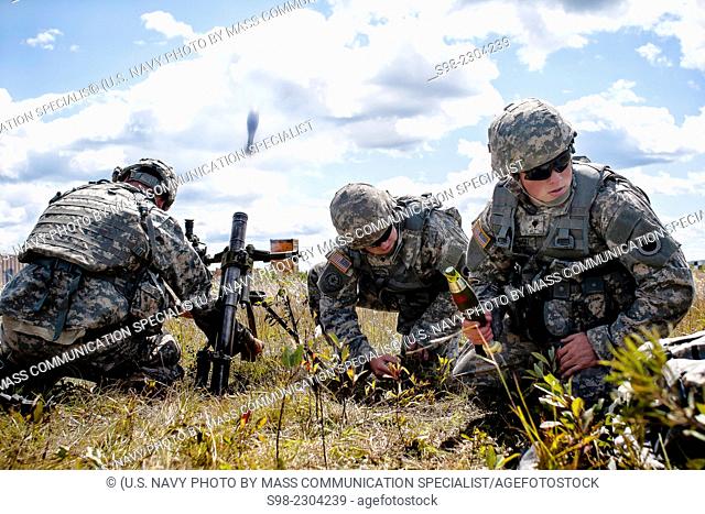A mortar team with 2nd Platoon, Charlie Troop, 1-126 Cavalry Regiment, Michigan National Guard, Dowagiac, Mich., fires the M224 60 mm lightweight mortar during...