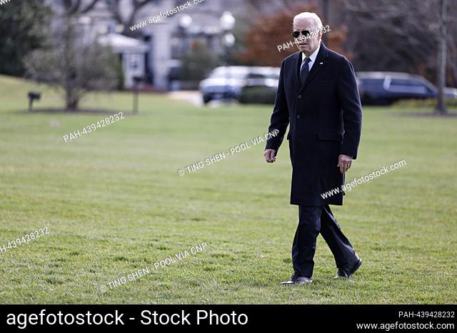 United States President Joe Biden walks on the South Lawn of the White House after arriving on Marine One in Washington, DC, US, on Tuesday, December 19, 2023