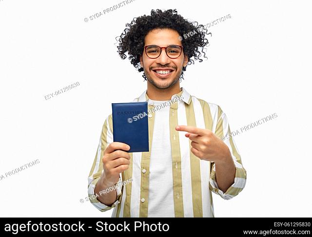 smiling man with passport