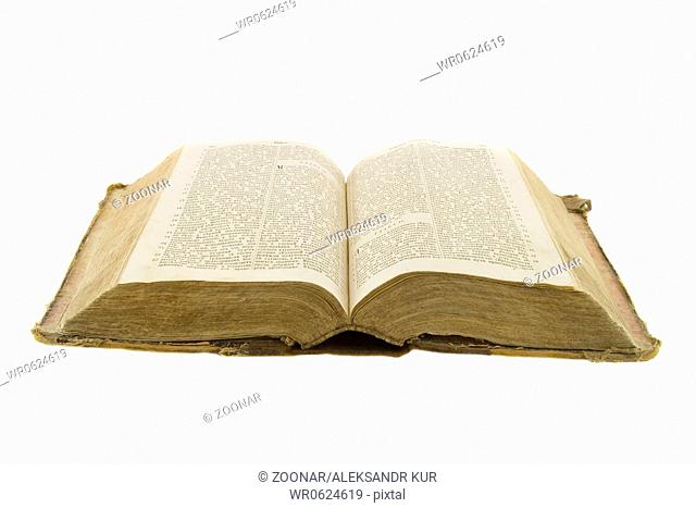 Vintage open book bible open for reading isolated on white